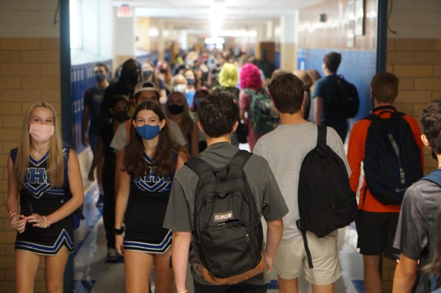Students flood the hallways on the first day of school. With 1,829 students and a main building capacity of 1,596, students find themselves in close quarters.