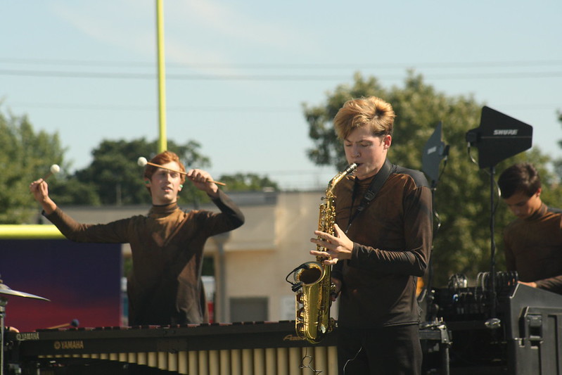 Alongside+junior+Oliver+Harrington+%28left%29+and+senior+Holden+Satterwhite+%28right%29%2C+senior+Will+Sharp+%28center%29+performs+his+saxophone+solo+in+the+band%E2%80%99s+UIL+competition+show%2C+%E2%80%9CMirage%E2%80%9D%2C+at+the+UIL+Area+Marching+Band+Contest.+Photo+by+Morgan+Eye.+