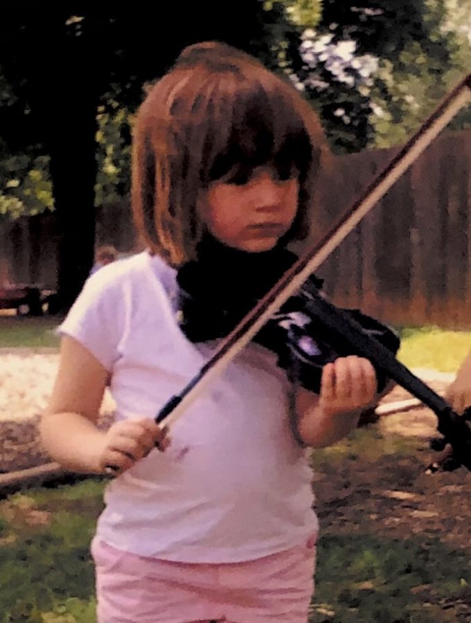 Georgia Halverson, now a sophomore, stands with her violin at age five. While jams are less frequent now, they’re still just as fun, bringing fiddlers and guitarists together to play. A solo fiddler will play improv with guitar accompaniment in front of peers, taking turns with others. This can be nervewracking for some, but it isn’t a deciding factor for Halverson, who’s been attending for years, “The worst part I would say would be the nerves that you have to overcome when playing.” 