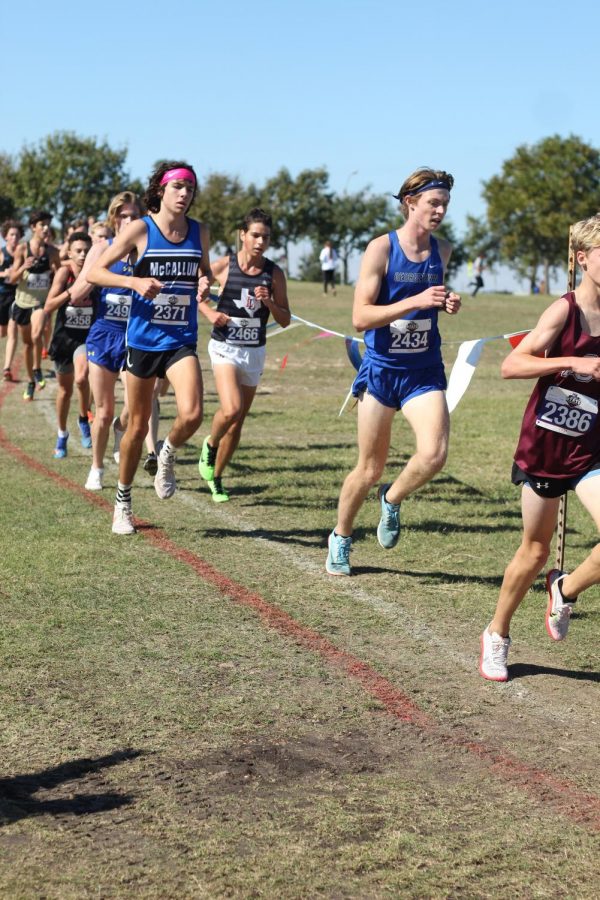 Thomas Melina Raab elegantly runs at the Texas UIL State cross country meet at Old Settlers Park, solely representing McCallum on the field.