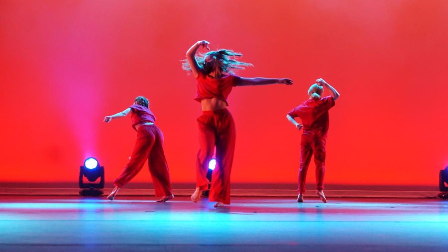 NEW YEAR, NO FEAR DURING SENIOR YEAR. Senior Annabel Winter performs center stage during the closing piece ‘New Year, No fear’ with the pre-professional group to end the "Breaking Ground" winter dance concert. According to Winter, the number was particularly special because of her connection with the choreographer Alyson Dolan. “I’ve gotten to work with the choreographer since seventh grade,” Winter said. “She choreographed two pieces for us at Lamar and one freshman year at McCallum, and it’s great to see how we have evolved as dancers since then.” Winter sees progression as an outlet for newfound creativity. “When we were younger, she mainly just set choreography on us, but now that we are older and have grown as dancers, Alyson has given us way more creative freedom.” Many of the dancers in the Pre-Professional group have been together since middle school and have collaborated on numerous pieces over the years. “I love to see these dances get more and more intricate as we grow up,” Winter said. It felt like a full-circle moment to be able to work with her one last time. Even though the number was really long and was difficult to rehearse, it was exciting because every time we did it, the piece was different.” Caption by Grace Nugent. 