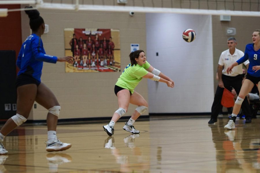 Katie Peterson, senior and McCallum varsity libero, slides to get a pass to the setter during playoffs against the Weiss wolves on November 2. Katie expressed how dire this game was for the team; “Several times during it I uncharacteristically found myself shaking and on the brink of what seemed like a little mental breakdown.” Winning this round of playoffs meant moving onto Area and being one step closer to state. Although McCallum ended up losing in 3 straight sets, they still tried their best and are ready to go even farther next season.