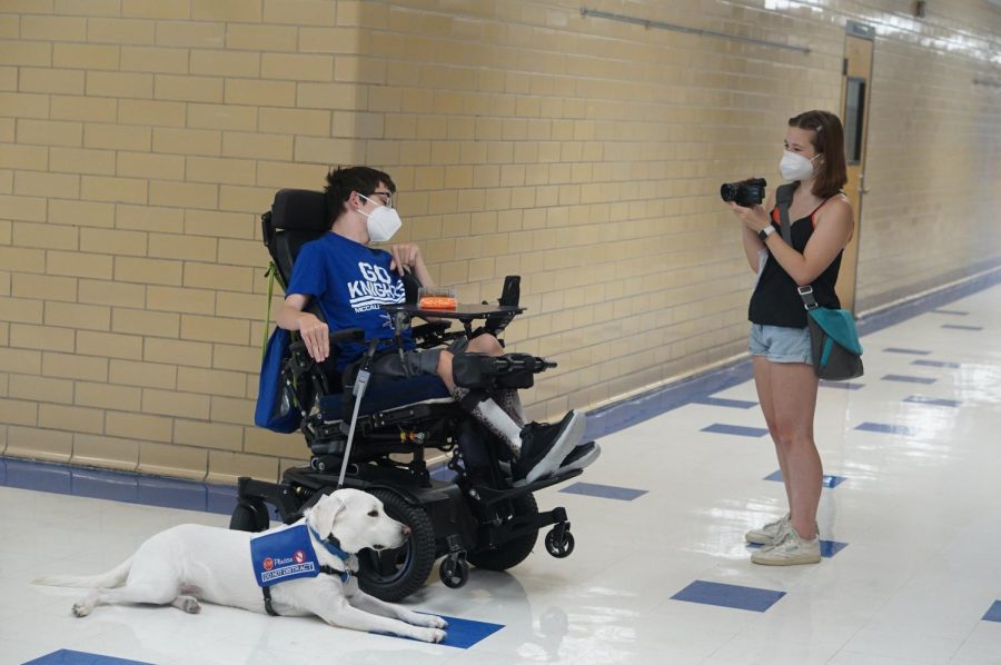 Sophomore Alice Scott interviews freshman Ben Polega who brought his service dog Friday to school on Aug. 16. The broadcast feature package that came from this interview, Thank God its Friday, won first place at the fall National Scholastic Press Association Best of Show competition, marking the first time that MacJournalism has earned a Best of Show Award in broadcast journalism.