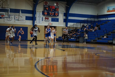 JV-B player Brianna dribbles down the court after a steal from the Eagles on a fast break.