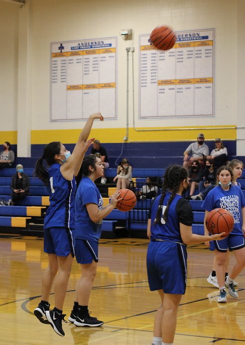 Isabella Cruz shooting while warming up for JV's game against Anderson.