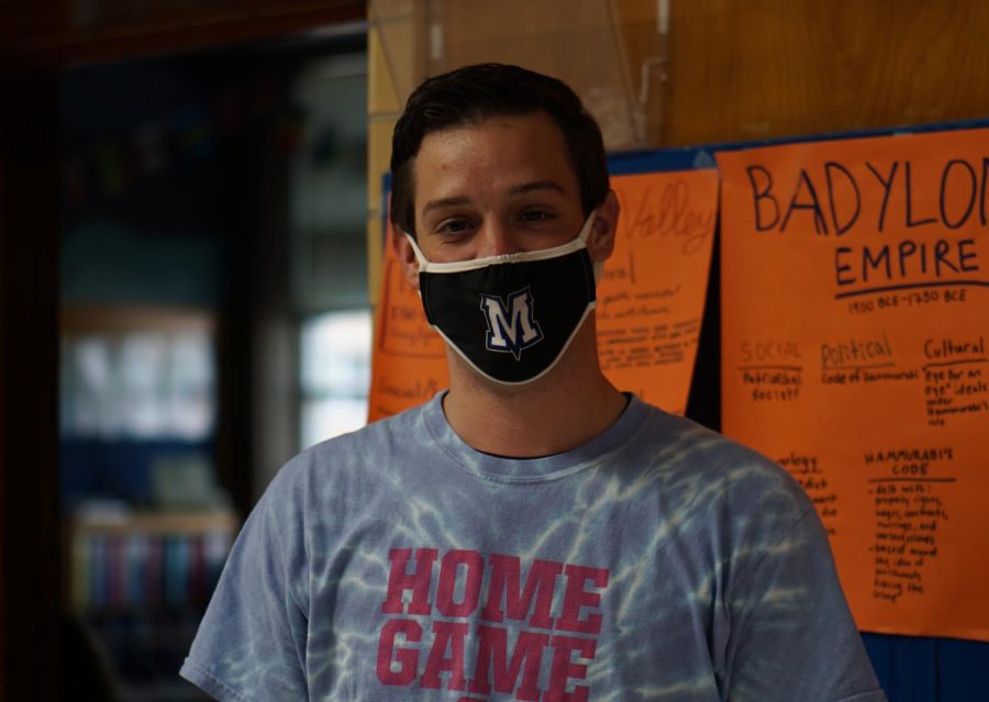 Social studies teacher Vaughn Stockton shows his spirit for his new school.