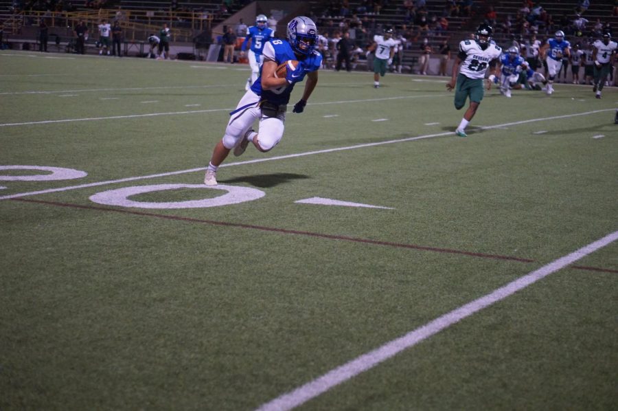 Fullback Brock Fanning catches a pass from Quarterback Jaxon Rosales and takes off downfield against Pflugerville Conally. 