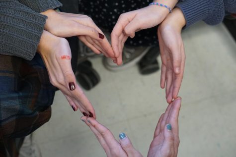 McCallum students form a heart in honor of National Teen Dating Violence Awareness and Prevention Month, symbolizing healthy relationships and strong support for survivors.