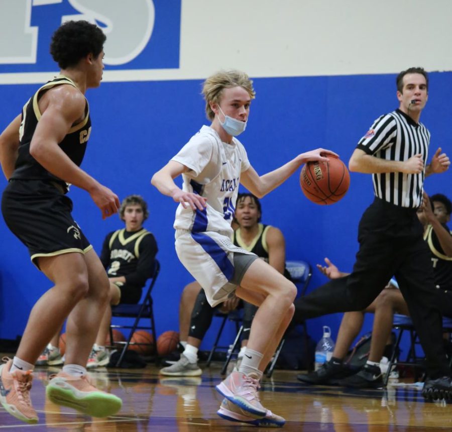 Sophomore Lemuel Winesett dribbles down the court during the JV game against Crockett on Febuary 8, 2022.
