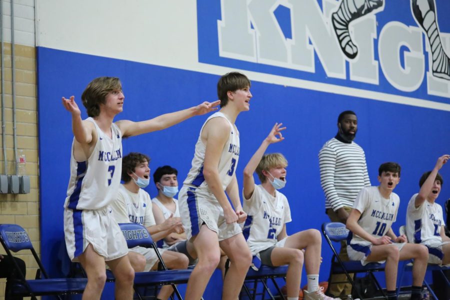 The JV team shows their team spirit and zeal from the sideline during the district match against Crockett on Febuary 11, 2022. 