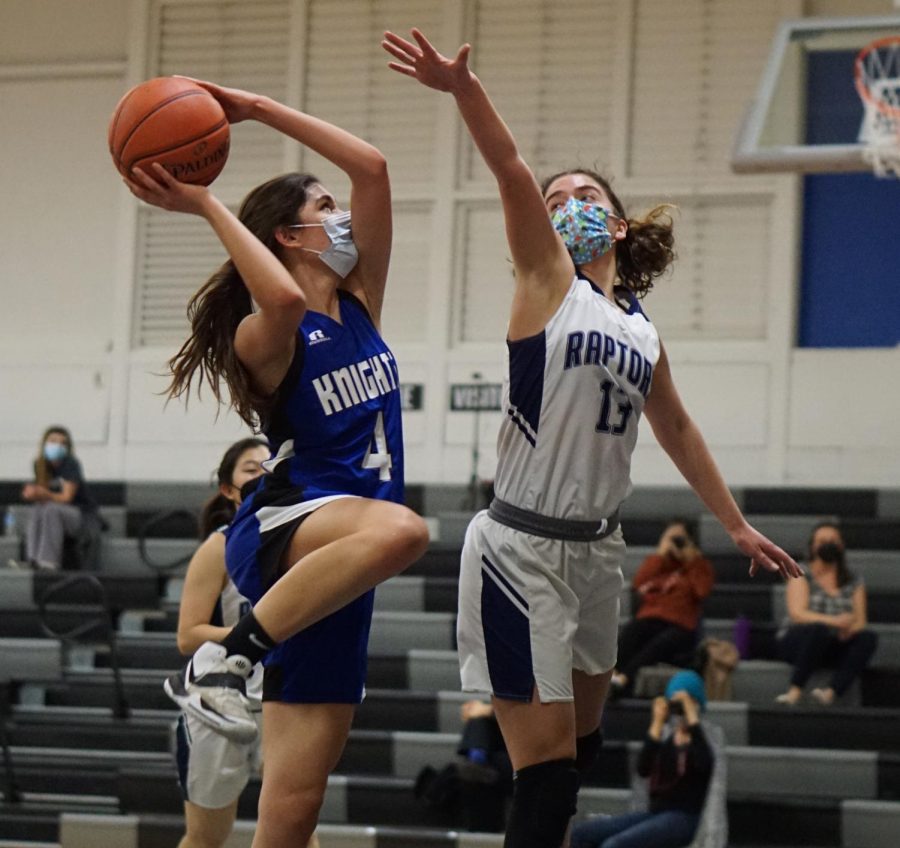 ONLINE SPORTS ACTION PHOTO: The varsity girls basketball team went on the road on Tuesday to play its second game against the LASA Raptors. The Knights were on top of their game, securing a season sweep against the Raptors with a 51-32 victory. Playing before only a few spectators on an unfamiliar court, the team played stifling defense, preventing the Raptors from getting into their offensive rhythm. Several JV players moved up to bolster the varsity bench that has been decimated by injuries and illness. According to sophomore guard Esme Barraz who returned to the lineup herself on Tuesday, having more roster depth made a big difference after Friday’s tough home loss to Crockett, which left the Knights with three eligible players at game’s end. “I think our intensity needs to go up for the rest of the games and playoffs,” Barraz said. “We need to learn to play without some of our key players.” The varsity and the JV-A teams play against Anderson Friday at home. The JV game tips off at 6 p.m., followed by the varsity at 7:30. Caption by Francie Wilhelm. Reporting by Grace Nugent.