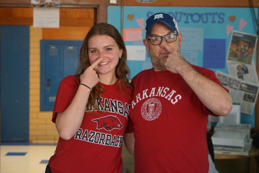 Senior Annabel Winter with her dad, journalism teacher Dave Winter sporting University of Arkansas shirts. She plans to major in marketing with a minor in education.
