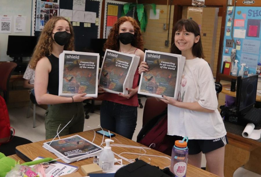 Senior staff leaders Alysa Spiro (co-EIC), Lucy Marco (co-online EIC) and Madelynn NIles (co-EIC) proudly display the recently arrived fourth issue o 2021-2022 prior to heading out into the hallways to distribute it.