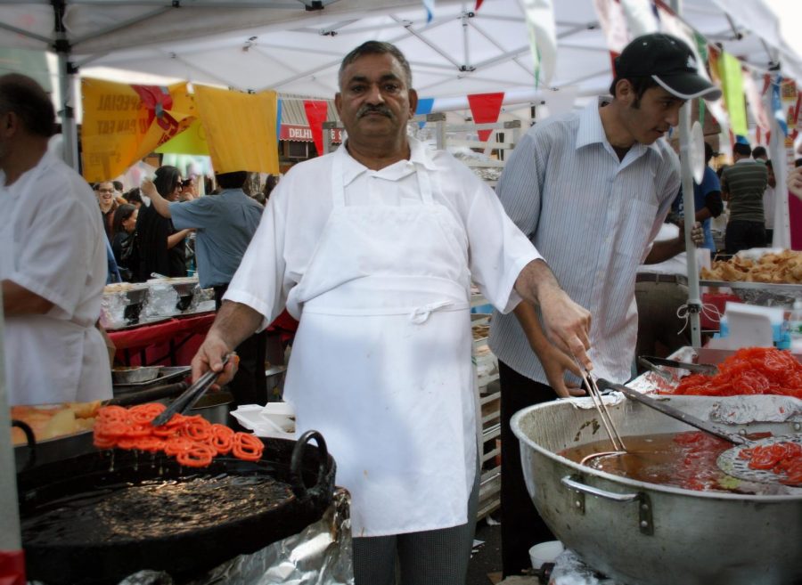 Home to greater immigrant diversity than any other place in New York, Jackson Heights often shares that diversity through food. One example is the Diwali Festival, a five-day long celebration of Hinduism and the victory of light over darkness. The Diwali Festival made a big in-person comeback in 2021 after the pandemic made it a virtual event in 2020. The street vendors in Jackson Heights offer another example. These vendors value the cultural exchange made possible through their cuisine but find it hard to negotiate the legal barriers to entry. Photo accessed on the Caitlin Regan Flickr account. Reposted here with permission under a creative commons license.