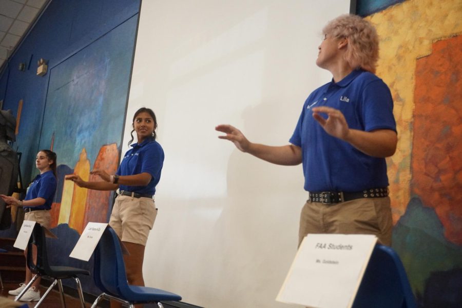 STARTING THE YEAR ON A HIGH NOTE: The McCallum Band drum majors lead the band as they extend a musical welcome to AISD Superintendent Dr. Anthony Mays on Aug. 15, the first day of school. After being informed of the superintendent’s visit a week in advance, the band began preparing “Hey Baby” and the McCallum fight song. Stephanie Gallegos, one of Mac Band’s four drum majors, said she was excited to perform for Mays and show him why the band had made a statement in the Central Texas area.

“The bands performance was a great way to welcome him to Mac,” Gallegos said. “There’s so much about Mac that’s inviting, and with how the band has been performing and competing in recent years, it was great to showcase it. Everyone was having fun from the superintendent to admin to the band. You could even see some smiles from people passing by in the halls.”

As a third-year drum major, Gallegos is responsible for keeping rehearsals running smoothly: helping the directors get music, helping the marchers and teaching new drum majors what needs to be done. After a “phenomenal” marching season last year, Gallegos hopes to help the band continue improving and climbing with hard work. Gallegos said that even if, as a drum major, she wasn’t playing, watching the band have fun as it played for the superintendent made her job 10 times better.

“As the superintendent entered and the band started playing “Hey Baby,” you could see him smile and start to dance,” Gallegos said. “I am fairly certain that he was singing along too. It made me laugh and smile as I was conducting.”

According to Gallegos, while performing for Mays was a “nerve-wracking” start to the school year, she had full confidence in the band to put on a good show. And, she said, the band delivered.

“It was a little hectic with it being the first day of school, but I think it perfectly captured life at Mac- a lot of fun but a little unpredictable.”

Caption by Ingrid Smith.