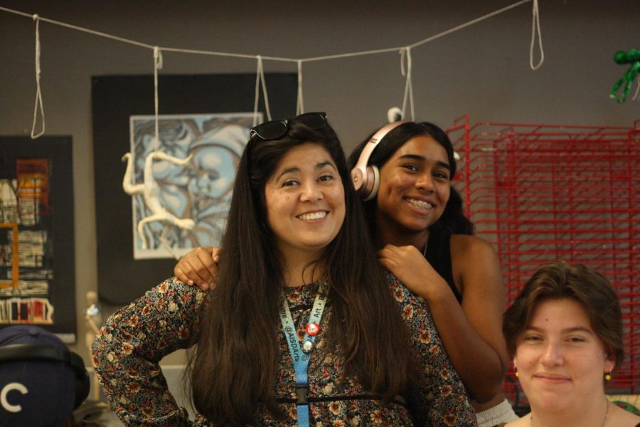 Art teacher Natalie Garcia smiles with students during one of her Art I classes. 