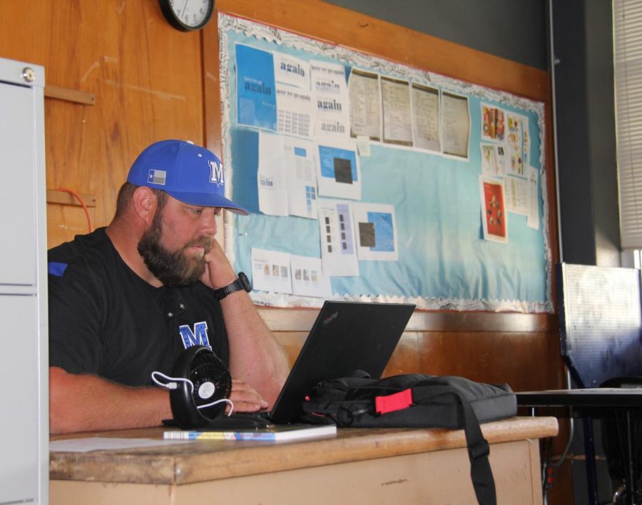 Coach Colton Collins sits in his office. Collins may be new as a faculty member, but not as a Knight. He attended McCallum as a student athlete under legendary coach Pat Honeycutt. 