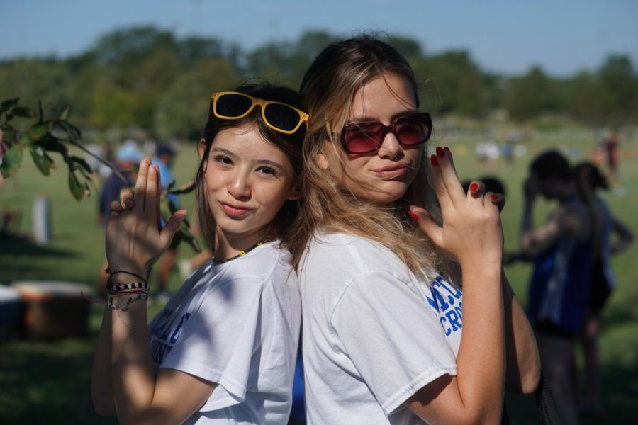 Senior Charlotte Wunz (right) with teammate Abbey Saray at the Hoka McNeil Cross Country Invitational. Wunz is captain of the girls cross country team this season, as well as the girls varsity tennis co-captain and one of the founders of the crochet club. 
