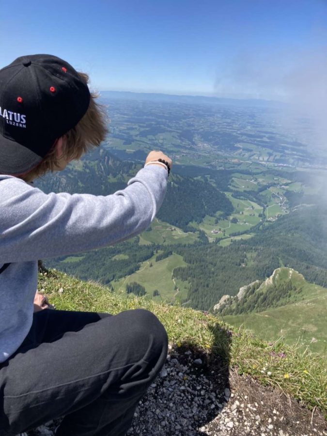 Junior+Philip+Tudor+looks+out+at+Lucerne%2C+Switzerland+from+the+top+of+Mount+Pilatus+on+the+summer+trip.+Students+on+the+trip+traveled+to+Germany%2C+Austria+and+Switzerland%2C+where+they+explored+the+Swiss+Alps.