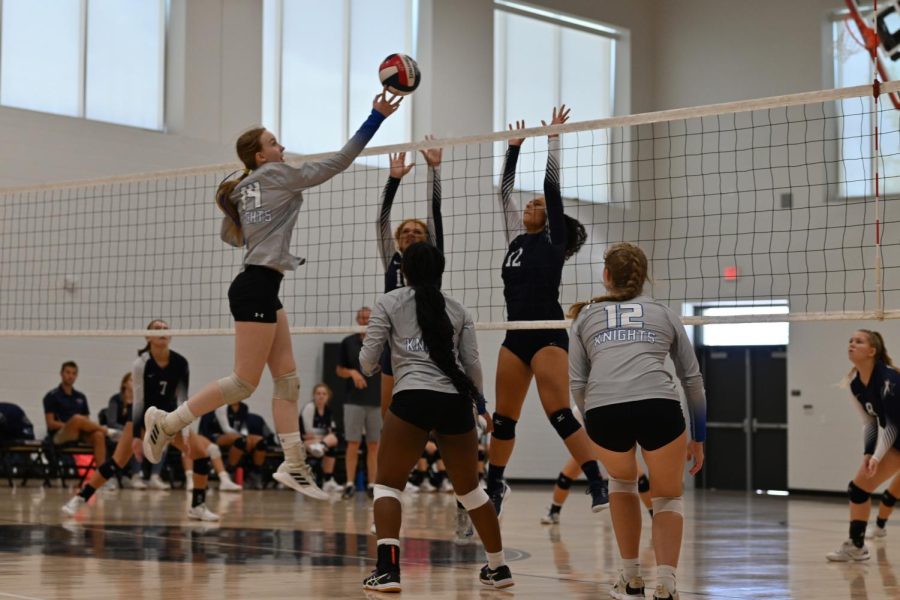 Sophomore middle blocker Greta Carlson elevates to play the ball over two TSD defenders during the Knights’ 25-11, 25-15 victory after two losses earlier during the second day of play at the AISD Jason Landers Invitational Tournament. While the victory was encouraging, the lessons learned in the team’s losses to two San Antonio powerhouses (Stevens and Macarthur) were more valuable in the long run.

“The game (against Stevens) for me personally was a learning moment,” said Carlson’s teammate Saraiah Taylor said. “Getting to know my teammates and how they react to certain things. I know we have the potential to go really far; we just have to communicate with each other. We all love playing together; [we] just [have] a few things that need to be fixed.”

Senior outside hitter Jette Morris said that the skills necessary to compete well in volleyball are so interrelated that struggles in one area can directly impact everything the team is trying to do. 

“We played pretty well the first set against Stevens,” Morris said, “but we lost our edge around 20 points in.” 

Morris elaborated on how a team’s momentum can unravel.

“Volleyball is so integrated that if the serve isn't aggressive, the other team gets a big swing; if the block doesn't close it's tough to give the setter a good pass. Sometimes you have a stinker of a day and I did. We kind of did, collectively.”

“Volleyball is so integrated that if the serve isn't aggressive, the other team gets a big swing; if the block doesn't close it's tough to give the setter a good pass. Sometimes you have a stinker of a day and I did. We kind of did, collectively.”

The team’s struggles continued into the team’s second match against MacArthur, a game the Knights’ ultimately lost, but even in defeat, the Knights showed their mettle. On one memorable play in the second set, senior setter Sariah Taylor dove to keep the ball in play but suffered an injury in the process.

“I’m going to do what needs to be done for my team even if that means getting hurt,” Taylor said of the play. “The double loss was not the best for the team, but I know that we can come back from that.”


After beating TSD to end their Friday games, the Knights won all three matches on Saturday and then split their final two games on Sunday to win the consolation final of the tournament’s Copper Bracket.

Photos and reporting by Morgan Eye.