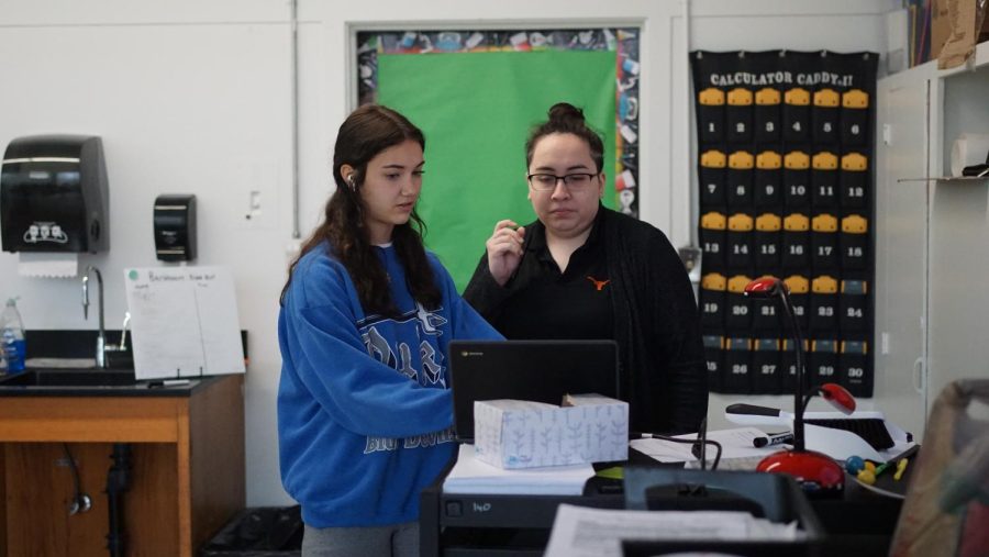 Alfarache and Villarreal set up for the November Science National Honor Society meeting.