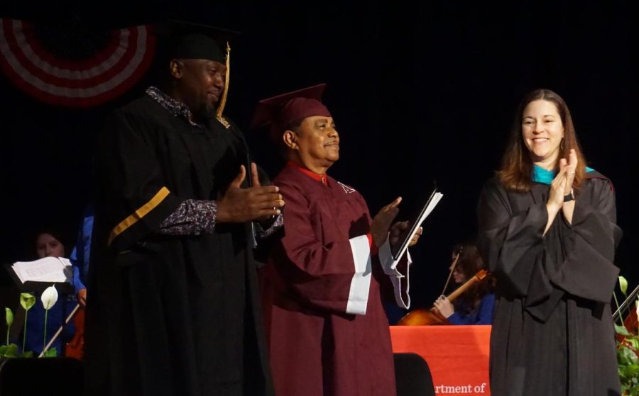 Veterans William Nealy and Ricky Sauls are celebrated after a Veteran's Day graduation ceremony.