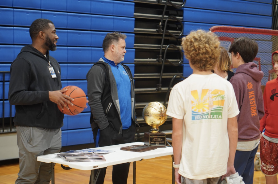 ROSTER ROTATION: During the ‘Knight at McCallum,’ coaches Daniel Fuentes and Carlin Shaw manned the basketball booth while some incoming players found interest in the team. The basketball season recently started up and the program is always on the lookout for new talent to take the team to new heights in the future. Caption by Merrill Price. Photo by Nate Williams.