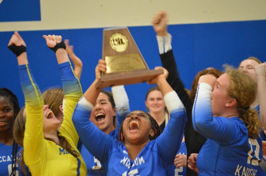 UNDEFEATED: Seniors Allie Roshalt, Saraih Taylor and Vaughn Vandegrift celebrate sweeping opponent Ann Richards and winning the district championship after an undefeated season. Taylor (middle) felt that both the district win and victory over the Stars were inevitable. 

“I was super confident going into the game,” she said. “We had already beat them, so what’s one more time?”  

The Knights won the match 25-21, 25-19 and 25-12 after previously besting Ann Richards on the road on Sept. 23. For Taylor, it was a moment to fully appreciate her and her teammates’ hard work. 

“I was so happy,” she said. “I was in awe because we did it, we won. I was so proud of myself and my team. It was like a proud mom moment.” 
Photo and caption by Francie Wilhelm. 