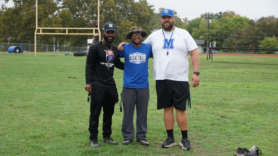 Coaches Houston, Stewart and Collins stand on the McCallum football field. All three are McCallum graduates and who returned to their coach the next generation of Mac Football.