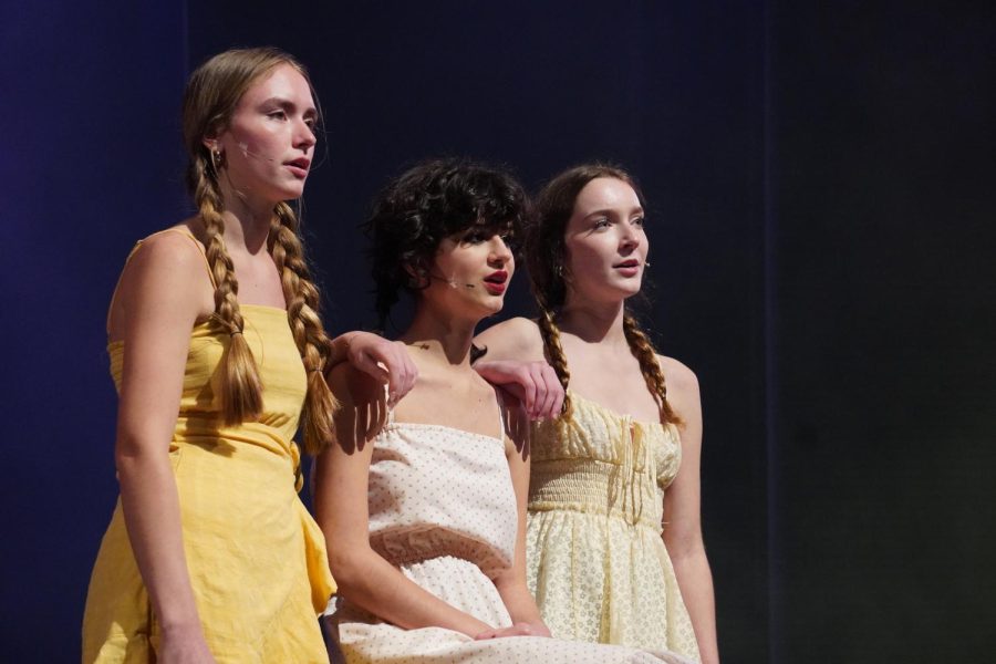 LAST TIME FOR THE TRIO: Seniors and chamber choir members Cate Thomason, Georgiana Murray and Stella Pitts perform “Landslide” in the style of The Chicks during a performance of the annual choir cabaret. This year’s cabaret production, themed “This is the Moment… Be a Light,” featured songs about the choice humans face to build someone up or break them down. Thomason said after four years of performing together, the trio’s personalities blend as well as their voices. For the trio, this Cabaret was bittersweet.

“We weren’t that nervous this year because we’ve been singing together for so long,” Thomason said.  “We were mainly just excited and sad that it was our last year singing together.”

Former choir directors Malcolm Nelson and Cheryl Lindquist returned to Mac to put on Cabaret this year. Thomason said Nelson and Lindquist’s fun taste in music made the experience even better.

“Cabaret is a lot of work but it’s a lot of fun music and an exciting experience,” Thomason said. “We are really fortunate to have Mr. Nelson and Dr. Lindquist coach and help us with everything. I think they’re really good at picking fun songs and putting so much together in such a short amount of time.”

Photo by Francesca Dietz. Reporting by Ingrid Smith.