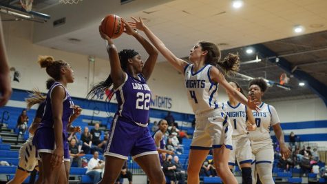 Junior Esme Barraz reaches for the ball in last Tuesdays game against LBJ, one of McCallum’s most formidable district competitors.

“They are second in the district, and last time we played them, we won in overtime,” Barraz said. “This being said, we really brought our energy and were able to execute enough to win.”

The Knights worked hard to support each other and executed successful plays to bring home the win and maintain the first place title.

Caption by Isley Cameron. Photo by Amira Habib Weymouth.