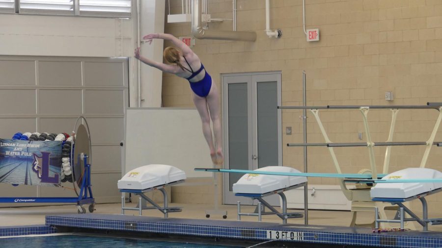 Freshman Iris Burns-Trahanovsky twists into a dive for the Girls One Meter Diving event. 