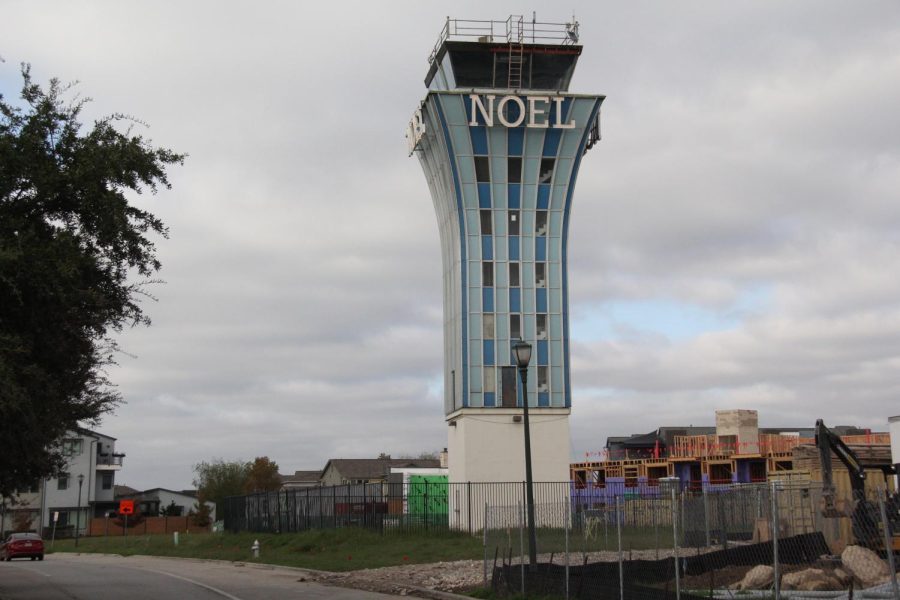 PLANS FOR THE FUTURE: The Noel Tower has not been used since the closure of the Robert Mueller Mueller Building. Instead, this tower has become an icon and a big characteristic of the new Mueller neighborhood. Every year, when December rolls around, the tower gets lit up to remember its old purpose.

However, Marko Garafulic thinks we should be doing more to make the tower more attractive to look at.

“Given that not much can be done with/within the tower, I’d like to see something of interest, and open to the public, built around the tower sometime,” said Garafulic.

There are other ways that the neighborhood is honoring the old airport. For example, the playscape in John Gaines looks like a set of runways from above. The new middle school being built also pays homage with a number of architectural details.

Caption by Maya Tackett. Photos by Maya Tackett and Lucas Walker.