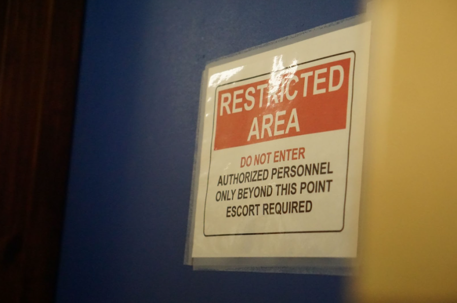 A 'Restricted' sign wards away any visitors to the school police officers.