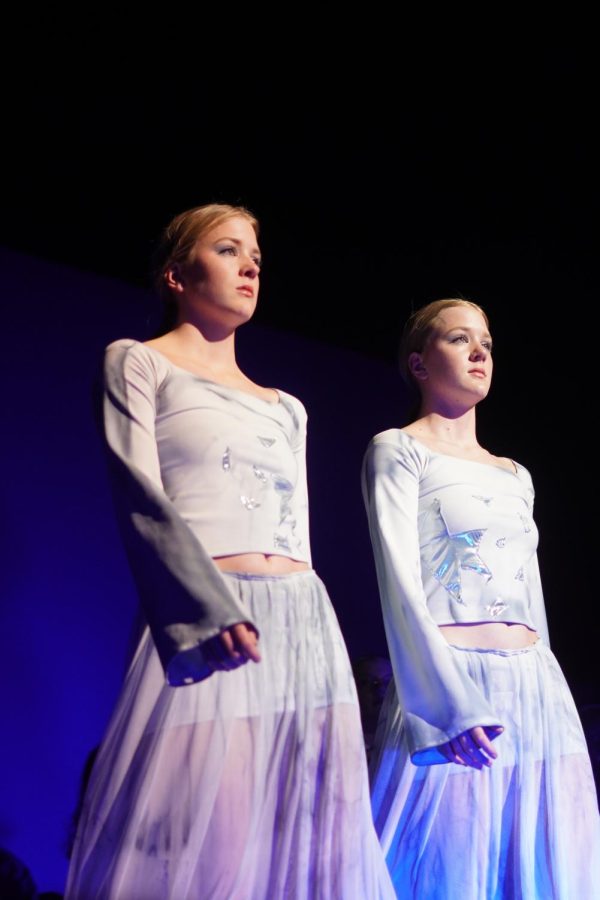 SEEING DOUBLE: Seniors Stella and Ruby Davidson walk down the runway in a mirrored pose, wearing outfits designed by seniors Sophia Gonzales and Parker Mitchell.

The outfits were made identical specifically for the twins to walk down in them side by side, representing the “reflections” theme.

“It wasn’t challenging [to be synced] we just had to step on the same foot each time we walked and that made it pretty easy from there” (Stella) Davidson said. “We felt confident and happy to be showing off our designers clothes!”

Caption by Elena Ulack. Photo by Charlie Partheymuller.