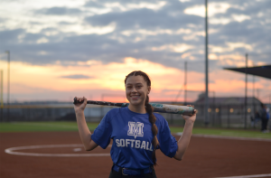 Senior softball captain Ary Sanchez poses with her bat out on the field at Feb. 6 scrimmage against Manor Tech. Sanchezs love for the sport started when she was young, growing up in a family of softball and baseball fanatics and joining her first team at age 5. Now, she leads the varsity Knights and represents the school decked out in a white and blue uniform.