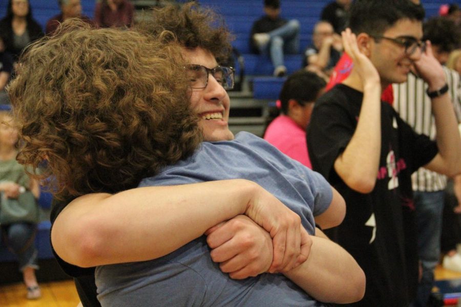 Sophomore Zane Wiggins and junior Jesse Silverman hug after beating one of their toughest competitors in the qualification rounds. This win brought them to a 5-0 record at the time. “I feel like we did great,” Silverman said. “A part of that success was being paired with very strong teams.”