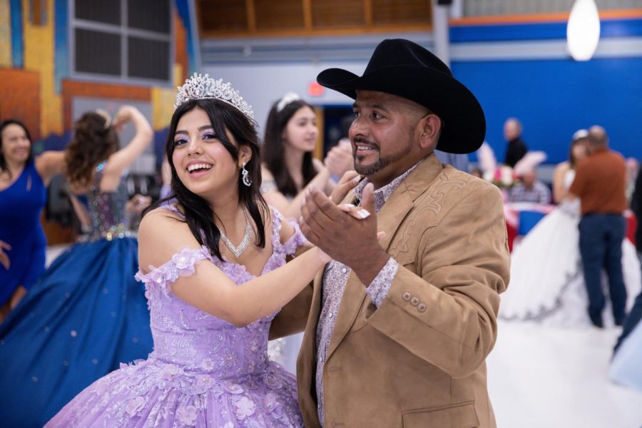 LOVE AND JOY: As she dances in her beautiful dress, sophomore Amy Love reflects on the joy it brings to see her father so happy during the McCallum Quinceañera. "I think that this event was really beautiful and fun to experience especially for my dad, seeing him so happy and having my family experience this," Love said. "My family isn’t big on doing huge celebrations so me and my sister weren’t able to have a quinceañera, but we loved being able to share this day with all the other quinceañeras and their families." Despite the stress of daily meetings and practices leading up to the event, Love found it all worth it for the fun and memories made on the quinceañera day. "It was really stressful doing the whole entire meetings and practice because it was every single day, but whenever it was the actual day of it, it was actually really fun," Love said. Overall, Love found the quinceañera event to be a very meaningful experience, which could not have happened without the hard work of Spanish teacher Juana Gun. "I want to give a huge thank you to Ms. Gun for making it all possible and being such a sweet person to all of us," Love said. Caption by Gergő Major.