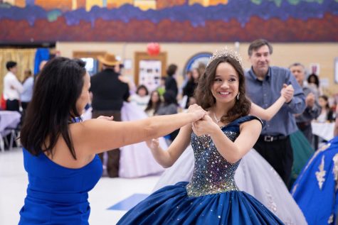 Junior Isabella Hernandez Scott dances with her mother at the quinceañera on Saturday. For Scott, the event made up for her own quince, which was affected by the pandemic.  I’m grateful for the opportunity to participate in something I thought I lost out on, Scott said. 