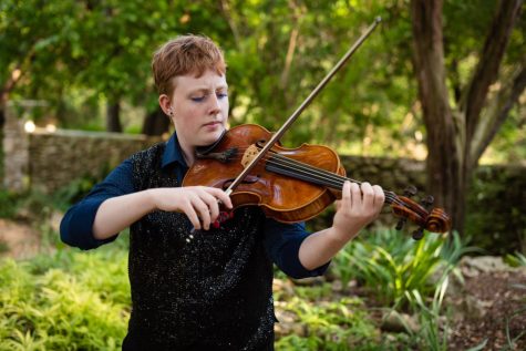 Campbell plays viola for their senior portrait. This fall, Campbell will attend Oberlin Conservatory where they will study viola. With classes on everything from chamber music to music theory available, Campbell believes that Oberlin will allow them to grow as a musician and person.