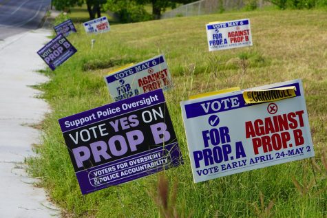 Dueling signs offer opposite views on the fate of Proposition B on Exposition Boulevard just outside the polling location at Westminster Presbyterian Church in Tarrytown.