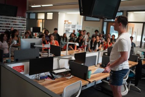 TOUR TIME: KUTs Chase Karacostas takes ILPC summer workshop students on a tour of the KUT offices inside the Dealey Center for New Media on the UT campus last Saturday to show students his companys workspace and the environment of a journalism and media company.

