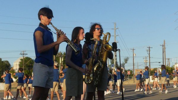 ONE FINAL HURRAH BEFORE THE TORCH IS PASSED DOWN: With the upcoming football season nearing a fast approach, the marching band is preparing its halftime segment for the games. While the first game isn’t until Thursday, the band took the opportunity to put on its annual Bandapalooza for family and friends. The events goal is simply to show off what the band has been working on and to give the community an early peek at whats to come.

For senior Frank Montesinos, Bandapalooza is not only a fun experience but also a beneficial one. 

“The showcase gives a perspective of how our rehearsals are run,” Montesinos said. 

While the show itself is a whole marching band production, Montesinos is part of a saxophone quartet with a feature in the second movement of the show along with William Viner, Elliot Taylor and Aubrey Mitchell. 

“It’s nice being able to show off our individual talent in such an exposed section,” Montesinos said.  

One of Montesinos fellow quartet members, senior William Viner said it was worth all the hours of work he and his bandmates put in.

“Bandapalooza is always the first performance we do for people,” Viner said. “It’s satisfying to finally get to put together a months work of heat and hard work.” 

But given that he’s a senior, it also means that this was Viners last Bandapalooza. 

“I thought I would be very sad in my last year,” Viner said, “but it’s honestly more sweet than bitter. I feel much stronger and more confident as a senior and a leader. It’s fun to pass the band torch down to new underclassmen.” 

Viner said he is excited to pass the tradition on to younger high schoolers just as early band members passed it on to him.

Caption by Chloe Lewcock.