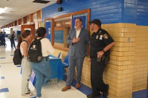 Principal Andy Baxa speaks with students on the first day of school.