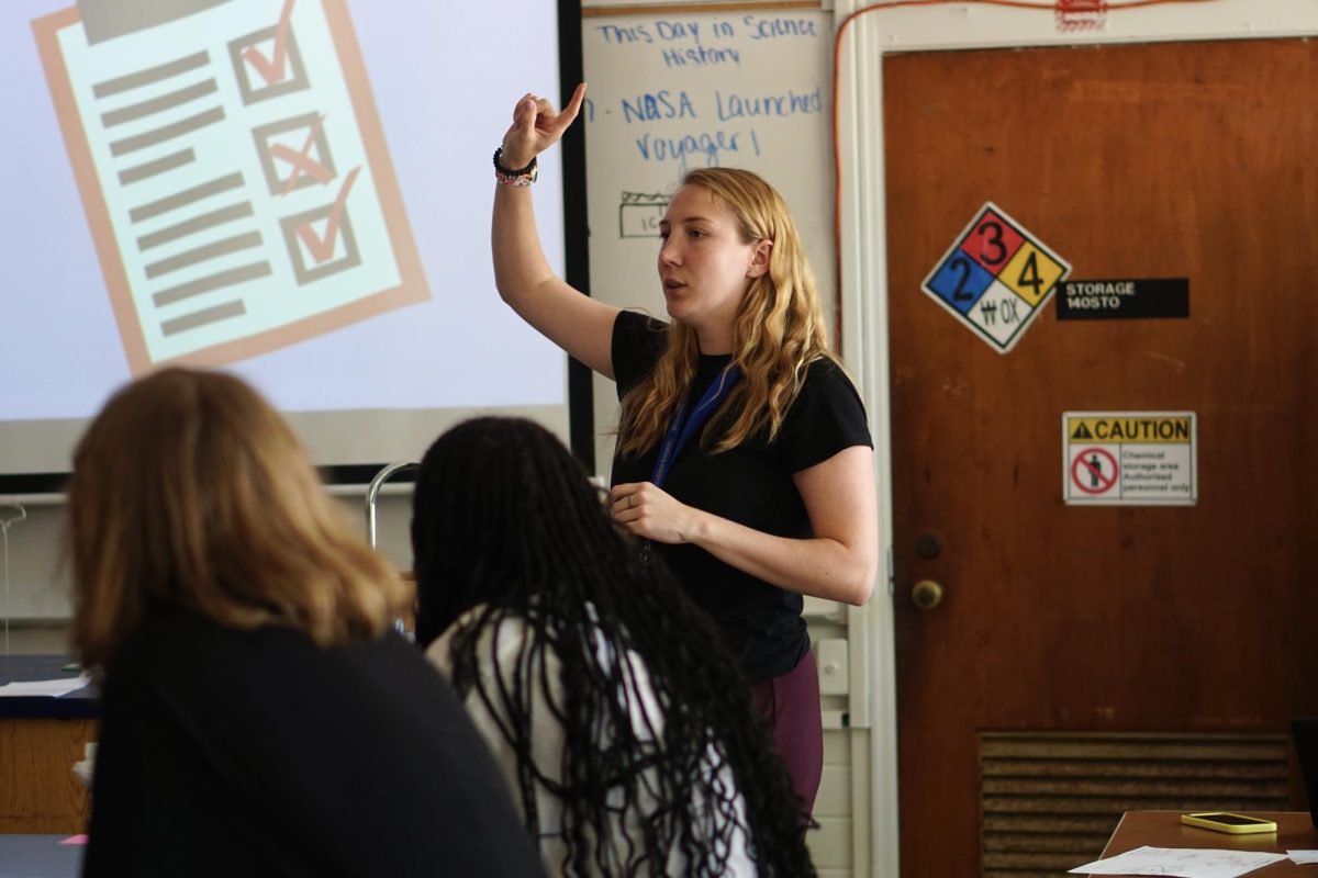 TEACHING CHEMISTRY WHILE BUILDING CHEMISTRY: Coming from a job teaching in Chicago and moving to Austin less than a month ago, Elizabeth Miller is arriving at McCallum to teach chemistry and coach the girls basketball team. 

“Everyone that I talked to before I got here was really inviting and that made me really excited,” Miller says.

Miller is passionate about both coaching basketball and teaching science. 

“I think science is really important for your life outside of school,” she said, “and I want to encourage women in science.”

Not only is Miller excited to instruct chemistry, she’s looking forward to making chemistry with her students as she connects with them.

“I’m excited to get to know my students better. I want to attend a lot of events,” Miller said. 

Caption by Zane Joly. 