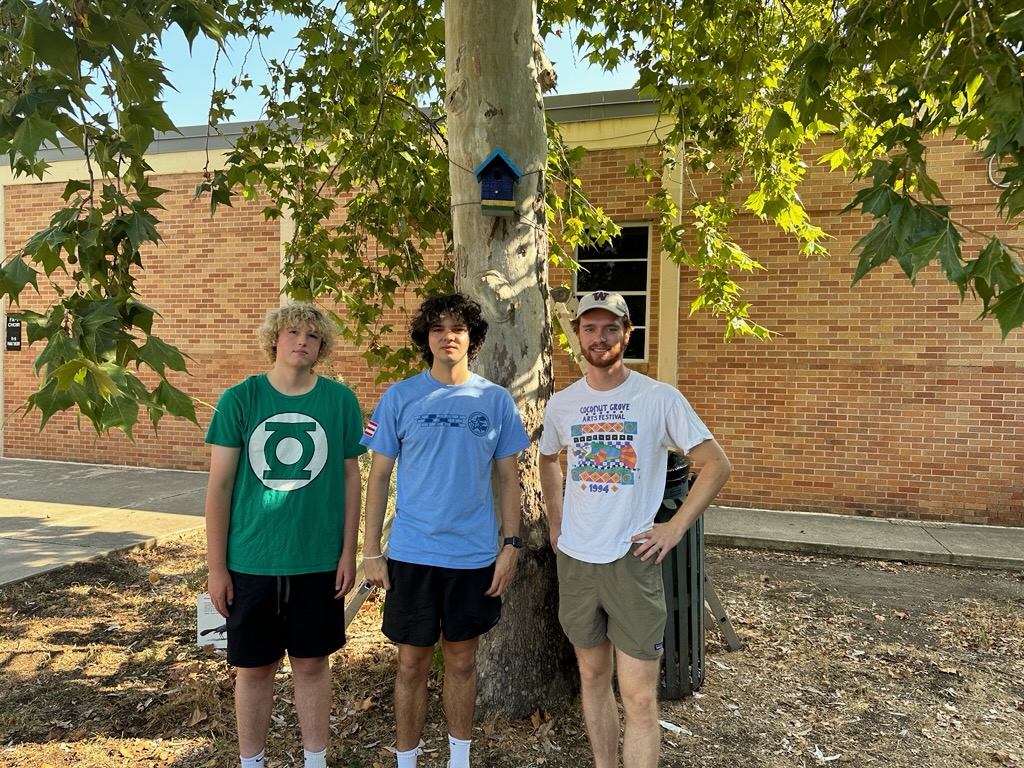 Owen Lucente stands in front of a birdhouse in the breezeway courtyard accompanied by fellow troop
member John McFarland, a senior at Austin High, on the left and Mac 2022 alum Eli Tachovsky on the right. Photo courtesy of Owen Lucente.