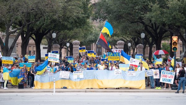 Protestors sit outside the Texas state Capitol to show their support for Ukraine. Austin Ukrainians initially held rallies outside the Capitol every day at the wars outbreak, but decreased them to once a week on Saturdays after about three months. A lot of people just come to stand with us, Kate Voinova, a prominent member of the Austin Ukrainian community, said. And this is really inspiring. 