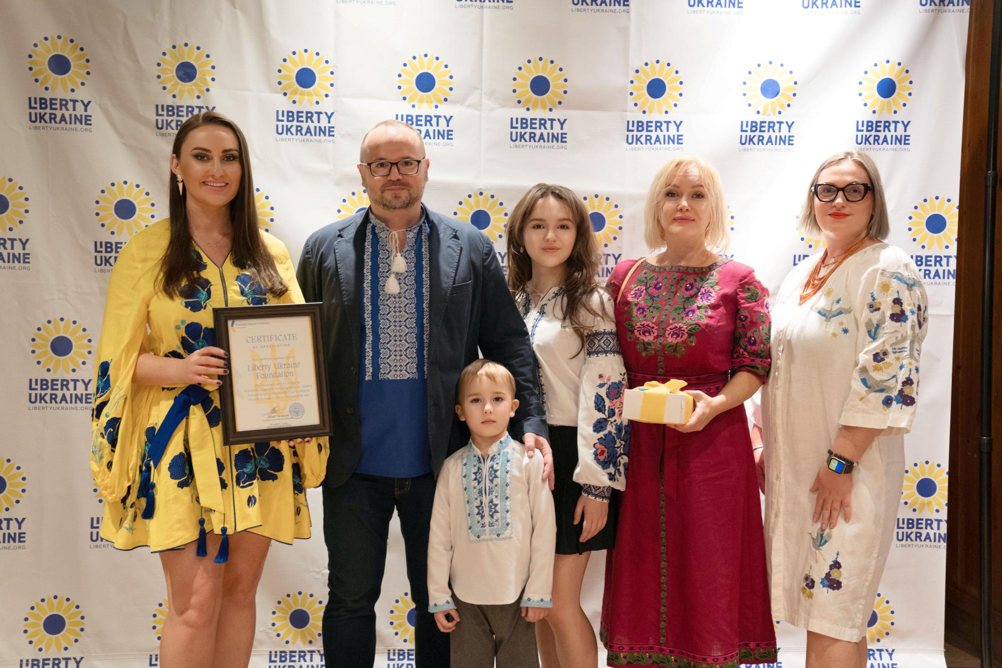 Tonya Levchuk (far left) and Kate Voinova (far right) stand with the consul general of Ukraine, Vatalii Tarasiuk, and his family at a celebration of Ukrainian Independence Day. Levchuk said she needs to be surrounded by fellow Ukrainians while their home country is at war. I do have a lot of friends here in Austin, but its important for me right now to be with like-minded people,” Levchuk said. “Thats why the Ukrainian community is so important to me because its the same pain for all of us. Photo courtesy of Kate Voinova. 