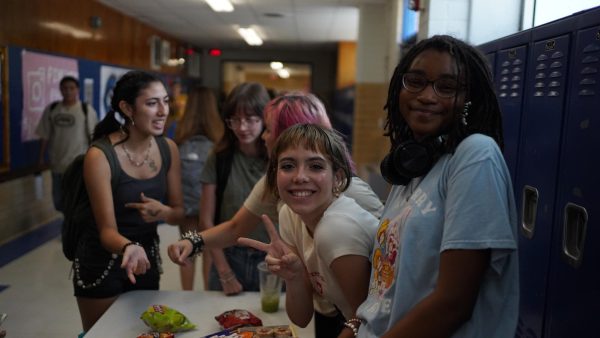 SPREADING THE JOY: Sophomore Chim Becker poses with sophomores Cozbi Sims and Lou Davidson while manning a table at the Hispanic Heritage treat day during lunch  of Sept 28. Becker is a part of the students of color alliance, who put together the activity to raise money for their club.

“It [the stand] was really fun because McCallum has a lot of latino kids,” Becker said. “And I think it was nice that I could share the stuff that I usually just have at home with people who have never tried it before.”

Becker recognizes the importance of celebrating Hispanic heritage at Mac.

“I think its important to celebrate,” Becker said. “Because our culture is awesome and super cool, and everybody should be able to learn about other cultures of the world.”

Caption by JoJo Barnard. 