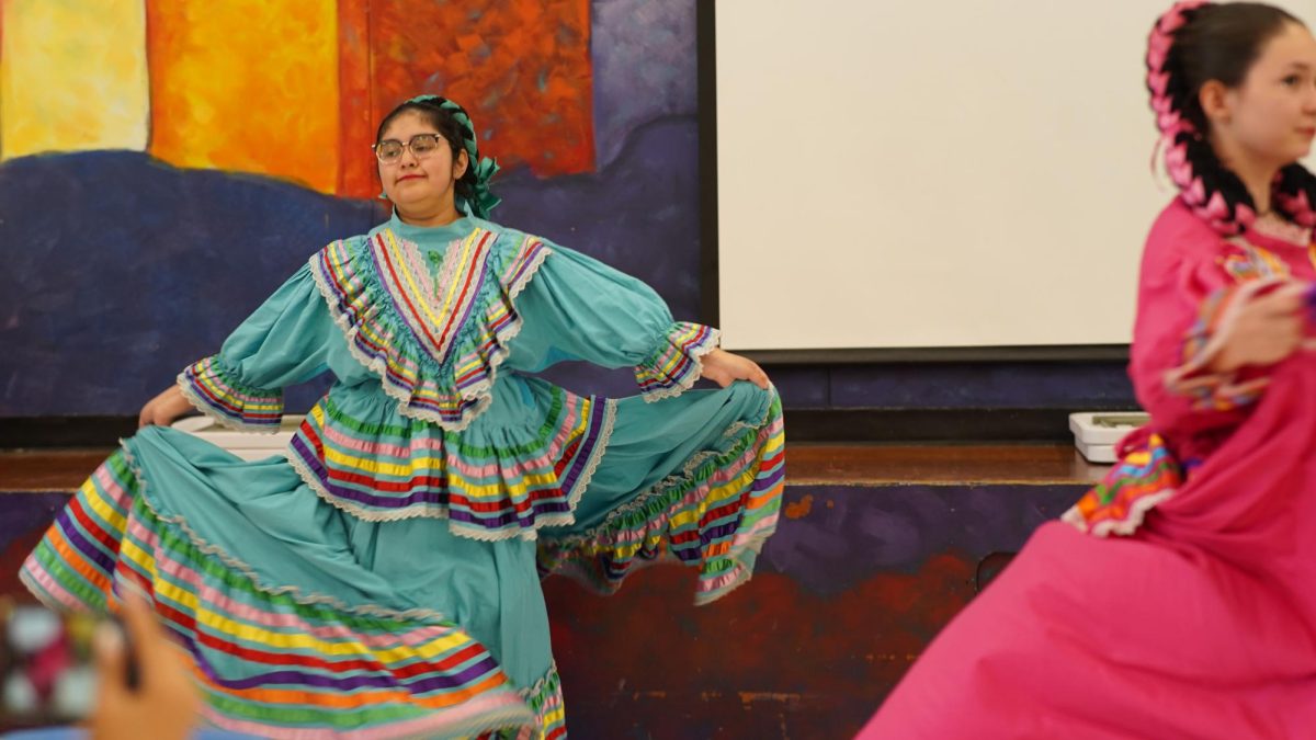 BIG SKIRTS, BIG SMILES: The Ballet Folklorico club performed in the cafeteria on Oct. 6 for Hispanic Heritage month in concordance with the Salsa contest in the hallway. 

Senior Julie Ponse is a dancer in the club, and reflected happily on the experience. 

“I think all the others did pretty well as well,” Ponse said.

She also explained how the club performs often for elementary school students.

“We do field trips, and just perform for younger kids,” Ponse said. “They get to see the party dresses.”

For Ponse, the Mccallum Ballet Folklorico club has been an important part of her family for a long time. 

“I really like that I do it, because my two aunts used to go here, and they were in it,” Ponse said. 

Overall, Ponse explained the positive community found in the club, especially through their leader, spanish teacher Telvi Altamirano Cancino. 

“I really like her [Altamirano Cancino]. I had her as a teacher last year, and she was really nice,” Ponse said. 

Not only does she enjoy the teacher, but Ponse also enjoys the company of the other students in the club.

“I think it’s really fun. We’re all friends,” Ponse said. 

Caption by Josie Mullan. 
